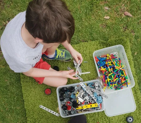 Child building with construction toys