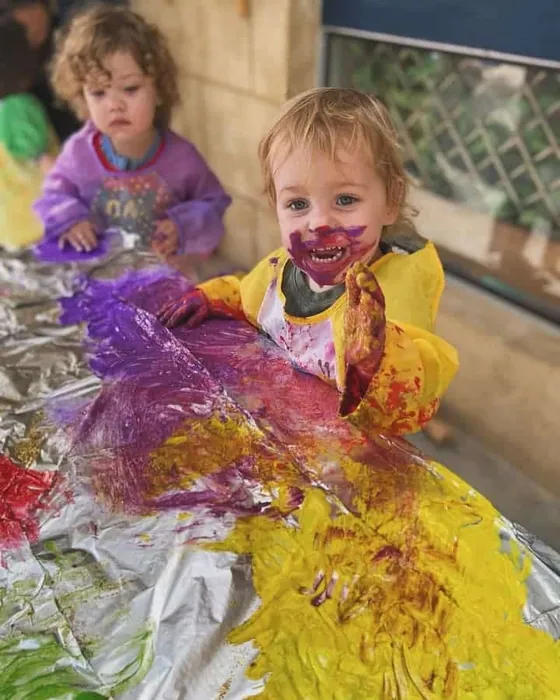 Toddlers painting together